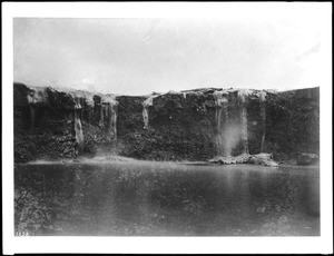 View across water at a Volcano Kilauea, Hawaii, lava flow