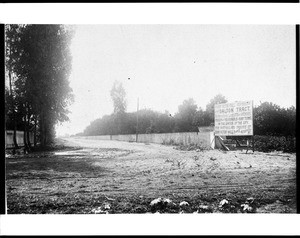 View of Charles Victor Hall's subdivision of the George Dalton, Sr. tract, a former ranch at Washington and Central Avenue, showing a sign advertising its sale, ca.1900-1910