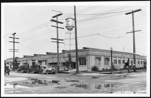 Exterior view of the Los Angeles Knitting Company factory on a rainy day, 1900