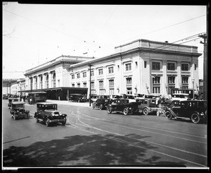 Exterior view of the Southern Pacific depot, located at Fifth Street and Alameda Street, showing automobiles, 1926