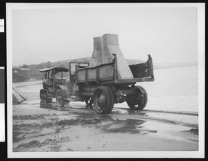 Construction of beach groins, showing a tractor and truck, 1953