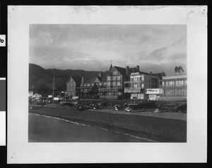 View of the Hotel Metropole at dusk from the harbor in Avalon, 1900