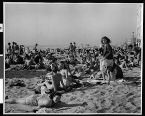 View of sunbathers on Venice beach, February 23, 1947 (1955?)