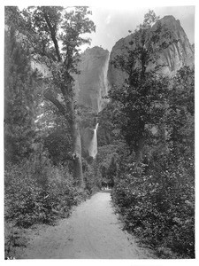 Tourists on horseback near Yosemite Falls in Yosemite National Park, ca.1900