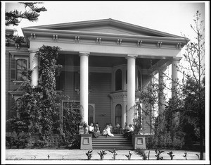 Women sitting on the porch of Lucy