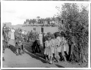 Priests with snakes in their mouths in the Hopi Snake Dance Ceremony, Oraibi, Arizona, ca.1898