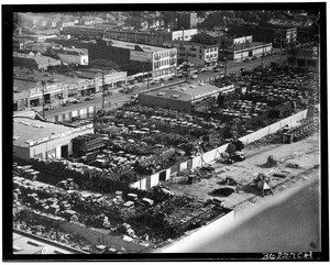 Birdseye view of an automobile junk yard on South Main Street near Fifteenth Street, Los Angeles, ca.1940