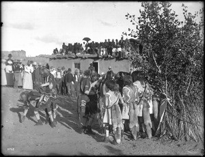 Braves sprinkling sacred meal on a released snake in the Hopi Snake Dance Ceremony, Oraibi, Arizona, ca.1898