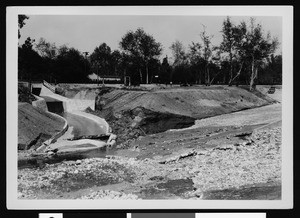 Concrete flood control channel meets free-flowing water