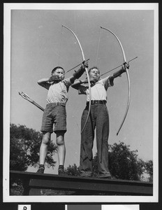 Boys learning archery in Los Angeles park, ca.1930