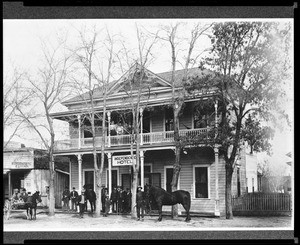 Group of people standing in front of the Independence Hotel in Independence, ca.1900