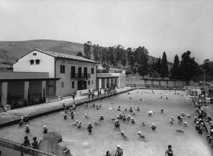 Crowded swimming pool at the El Sereno Community Building & Plunge, 1930-1940