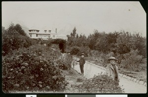 Three children on a path leading to the Andrew McNally residence