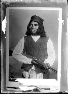 Portrait of an Apache warrior holding a Winchester rifle, ca.1884