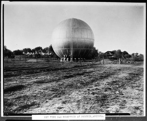 Spherical gas reservoir in the middle of a cleared field