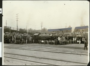 Frank Wiggins and a crowd at a railroad station