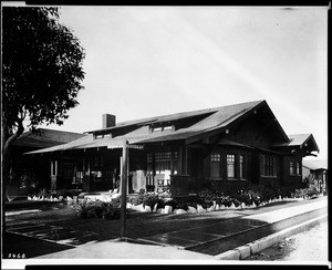 Exterior view of an unidentified Craftsman-style bungalow on the corner of Maines Avenue and Romero Street