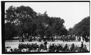 Outdoor play showing a band, performers wearing bolero dress, and horsemen, Claremont, ca.1930