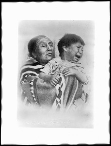 Washoe Indian grandmother holding her crying grandson, 1898