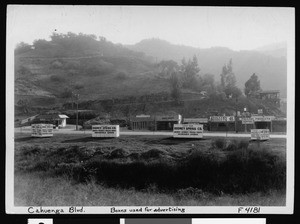 Large boxes on the side of Cahuenga Boulevard advertising Sprigg Moving and Storage Company, Hollywood, September 17, 1936