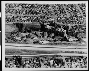 Aerial view of the McKinley Home for Boys, showing tract housing in the background