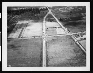 Aerial view of flooded road intersection south of Rosemead, ca.1935