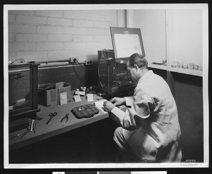 Employee of the Handy and Harman Company at work, ca.1935