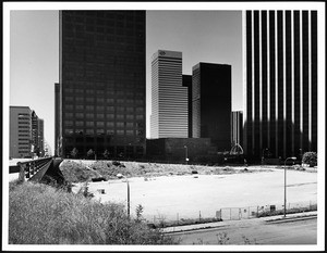 Cleared lot as viewed from the west side of Grand Avenue looking south from 3rd Street, April 1, 1986