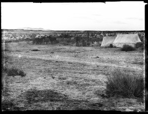 Group of people camping with tents at Coyote Wells, ca.1900