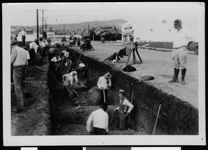 Men digging a trench during the construction of a storm drain at Eastern Avenue north of Twining Street, 1934