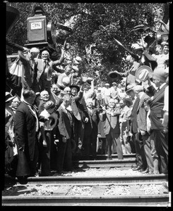 View of William Crocker as he prepares to drive a rail spike at the recreation of the driving of the final spike on Southern Pacific's Los Angeles-San Francisco line, September 5, 1926