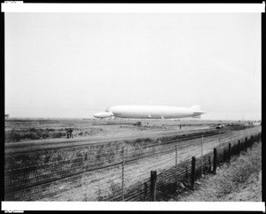 View the Graff Zeppelin and the Goodyear Blimp in a field, ca.1929