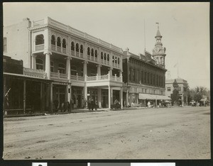 Street scene showing the Tremont Hotel, 1900-1940