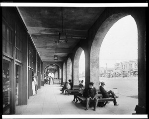 People sitting in the colonnade of the Pavilion in Redondo Beach, ca.1900