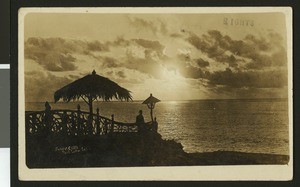 Silhouette of a man looking at the sunset over the ocean at Point Loma, ca.1920