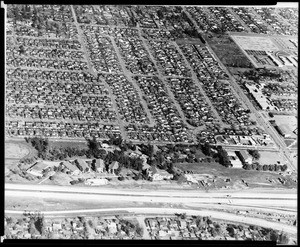 Aerial view of housing tracts in Van Nuys and Sherman Oaks, showing the McKinley Home for Boys