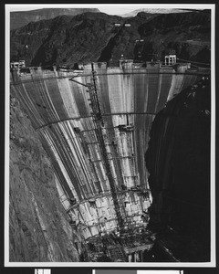 Construction of Boulder Dam, showing the back side of the dam, ca.1930