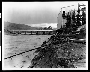 Flood damage to landscape and bridges, showing "Warner Bros. F.N. Studios", 1938