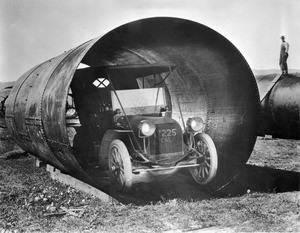 Siphon pipe with an early automobile inside, San Fernando Valley, California