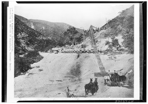 Workers using a ramp to tunnel a section of aqueduct in Soledad Canyon