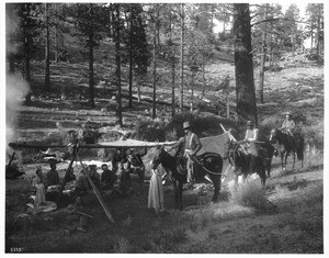 Hunting party returns on horseback to camp, ca.1900