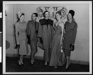 Models wearing the suits and evening gowns, ca.1950