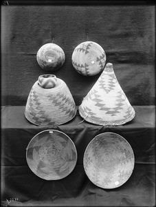 Five Indian baskets on display, ca.1900