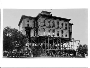 Fort Moore Hill High School (Pound Cake Hill, Signal Hill) being moved across Temple Street and Broadway, Los Angeles, 1886