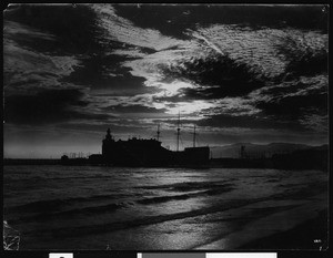 View of the amusement park at Venice Beach silhouetted by moonlight, ca.1910