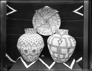 Three Indian baskets on display, ca.1900