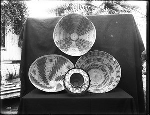 Four Indian baskets on display, ca.1900