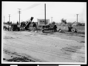 Tractors during the Department of Public Works construction of a road