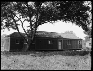 An exterior view of a one room house