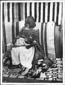 Young Walapai Indian mother with child on her lap, Hackbury, Arizona, ca.1900